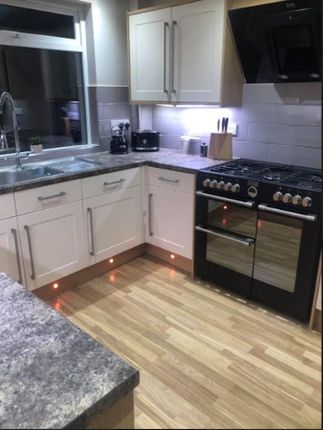 A Modern And Well-Maintained Kitchen Featuring Sty...