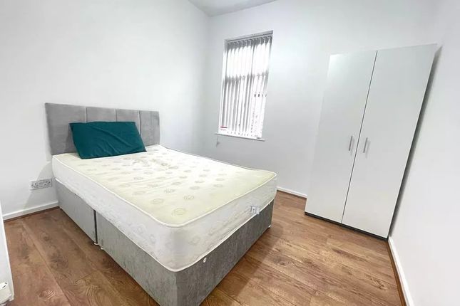 A Bright And Tidy Double Bedroom Featuring A Comfo...