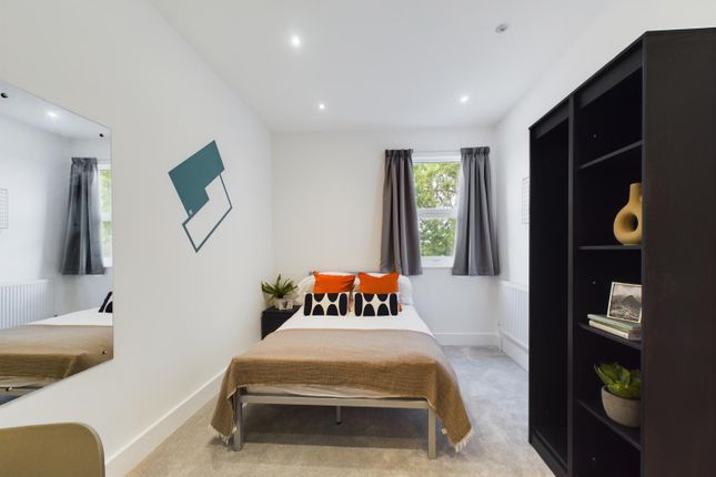 A Bright And Inviting Double Bedroom Featuring Mod...
