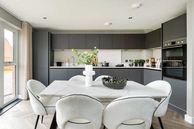 A Modern Kitchen And Dining Area With Ample Storage