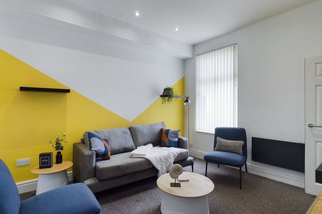 A Stylish And Inviting Large Modern Living Room Wi...