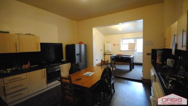 A Spacious And Well-Lit Living Room Featuring Mode...