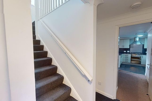 A Well-Maintained Staircase Leading To The Upper l...