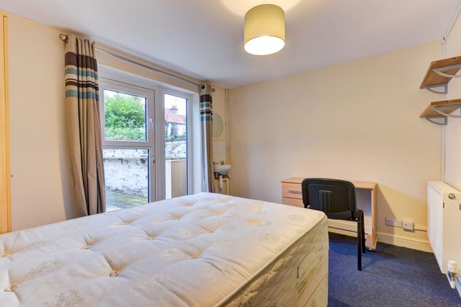 A Bright And Spacious Master Bedroom Featuring A c...