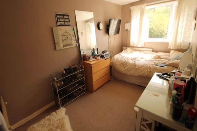 A Cozy Single Bedroom With A Comfortable Bed By A ...
