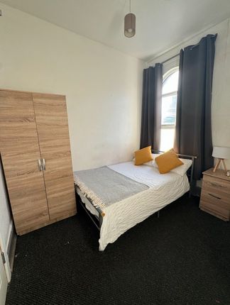 Cozy Double Bedroom Featuring A Comfortable Bed Wi...