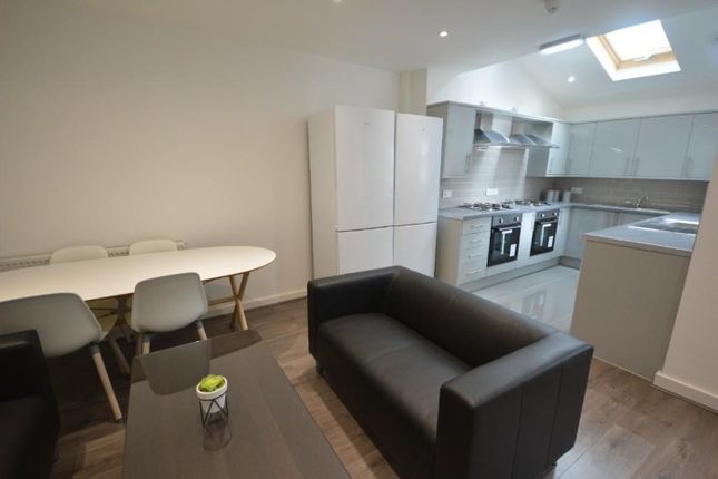 Modern Kitchen Featuring Sleek Cabinetry, Ample Co...