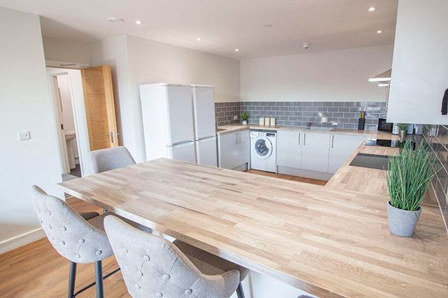 This Modern Kitchen Features A Spacious Layout Wit...