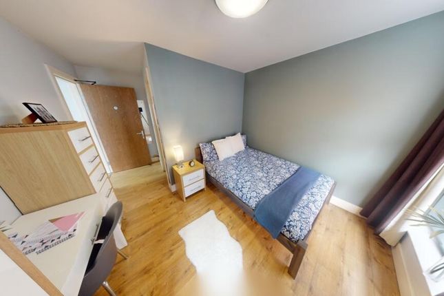 Bright And Tidy Single Bedroom Featuring A Cozy Si...