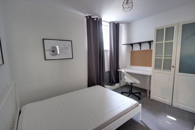 A Bright And Inviting Double Bedroom Featuring A c...