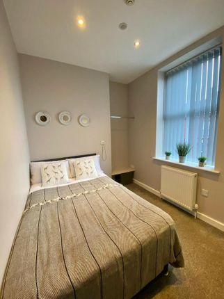 A Bright And Inviting Double Bedroom With Modern d...