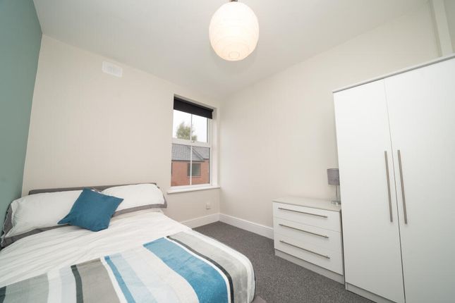 Bright And Tidy Single Bedroom Featuring A Comfort...