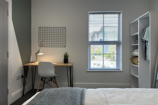 A Bright And Inviting Double Bedroom Featuring A S...