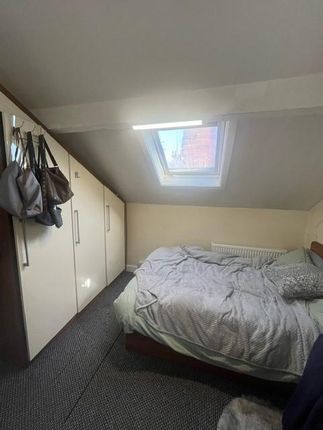 A Cozy Bedroom Featuring A Double Bed And Wardrobe...