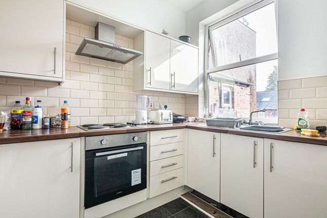 Bright Galley-Style Kitchen With White Cabinetry, ...