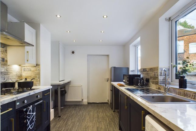 A Bright And Modern Kitchen With Ample Space For c...