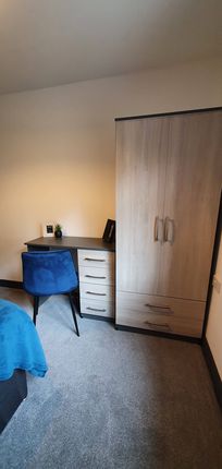 Cozy Double Bedroom Featuring A Stylish Desk And A...