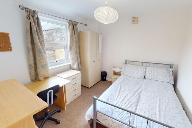 A Bright And Tidy Double Bedroom Featuring A Comfo...