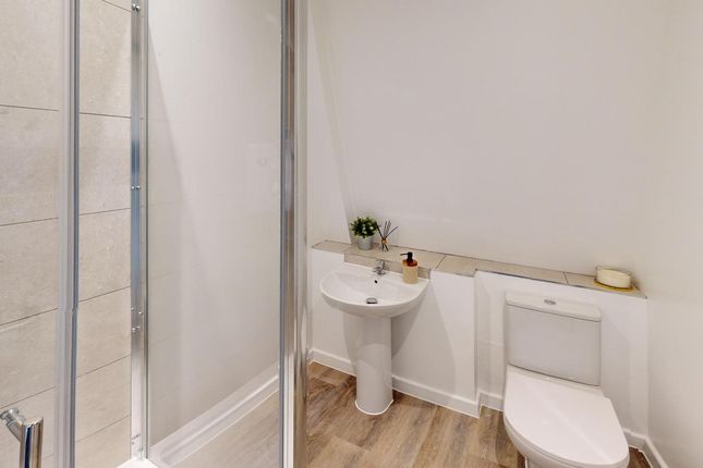 A Modern And Clean Bathroom Featuring A Spacious S...