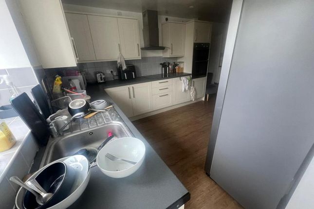 A Spacious Kitchen With Modern Appliances, Perfect...