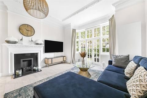 Bright And Stylish Living Room Featuring A Comfort...