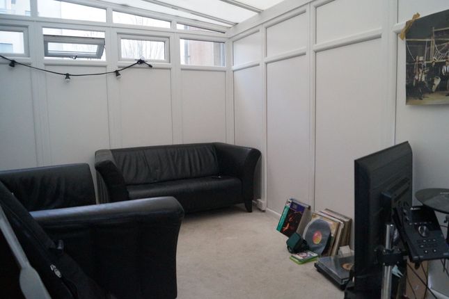 Cozy Communal Lounge Featuring Comfortable Black l...