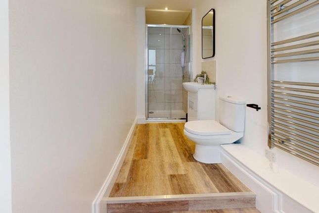 A Modern And Clean Bathroom Featuring A Spacious l...