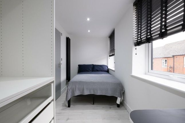 This Inviting Double Bedroom Features Ample Natura...