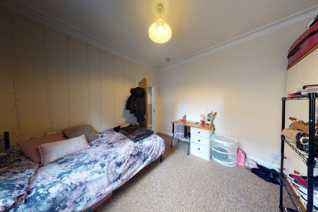 Cozy Single Bedroom Featuring A Comfortable Bed Wi...