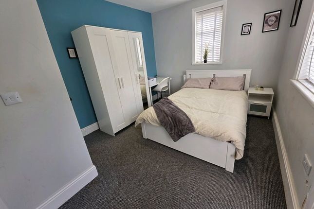 A Neat And Cozy Double Bedroom Featuring A Comfort...