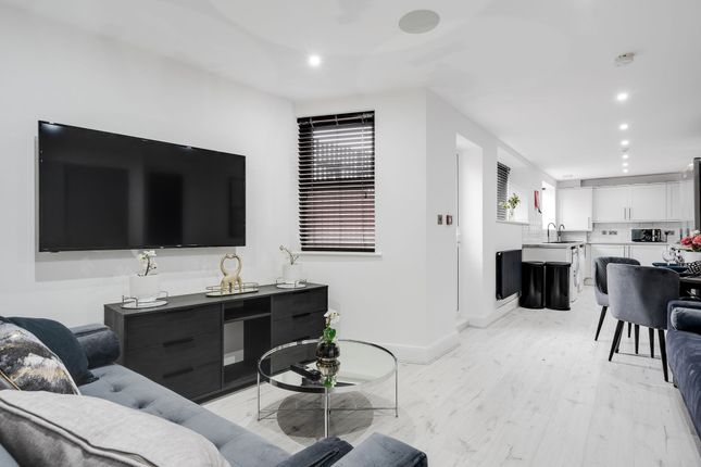 Modern And Welcoming Living Room Featuring A Large...