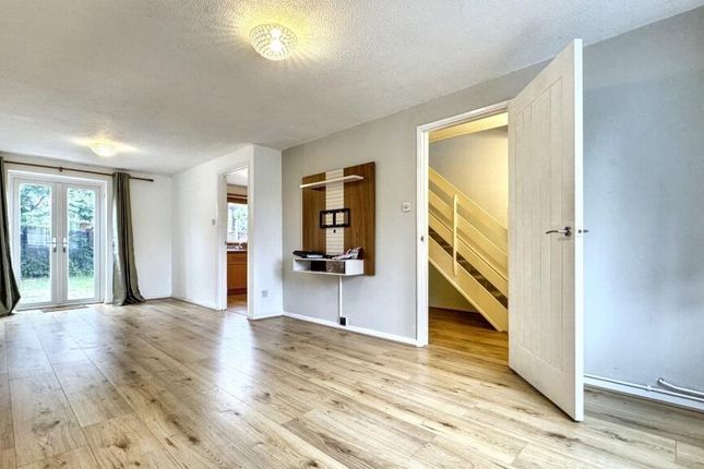 Bright And Spacious Living Room Featuring Light Wo...