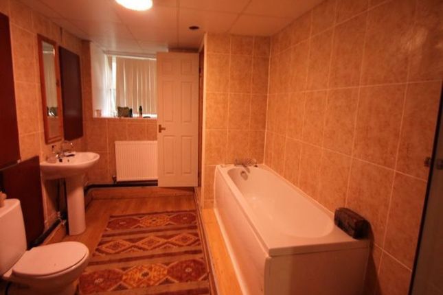 A Spacious Bathroom Suite Featuring A Full Bathtub...