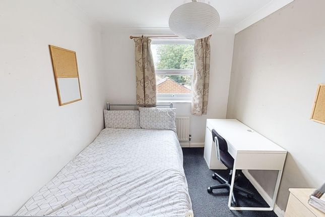 A Bright And Tidy Double Bedroom Featuring A Comfo...
