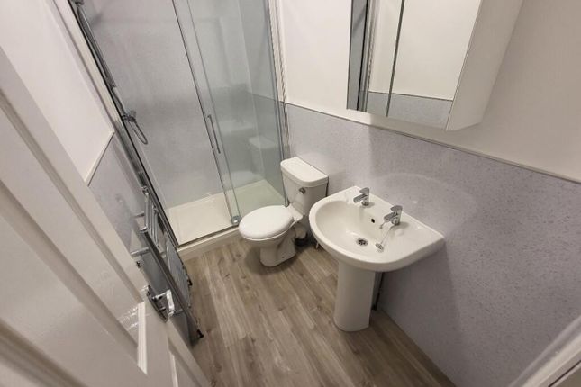 A Modern And Stylish Bathroom Featuring A Sleek Sh...