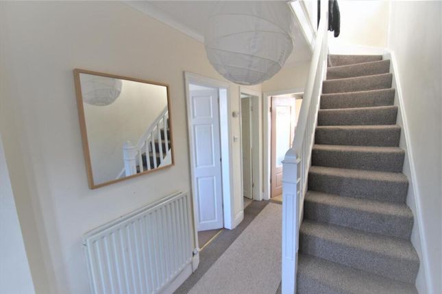A Welcoming Hallway Featuring Light-Colored Walls ...