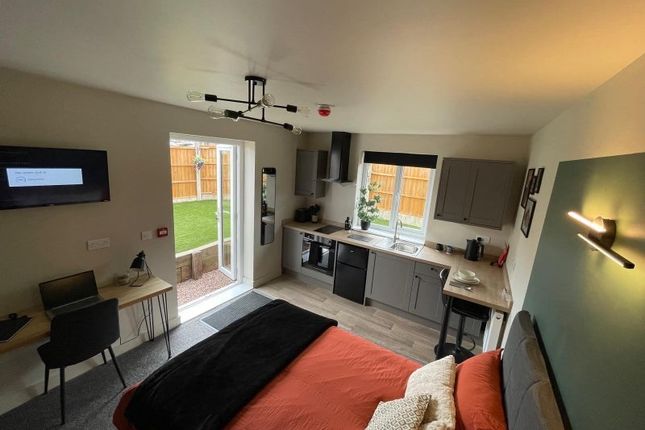 Bright And Modern Master Bedroom Featuring A Comfo...
