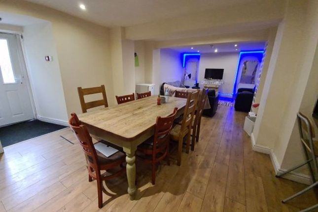 A Spacious Living And Dining Area Featuring A Larg...