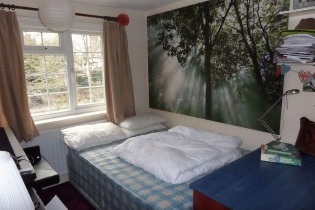 A Cozy Bedroom With Natural Light From The Window,...