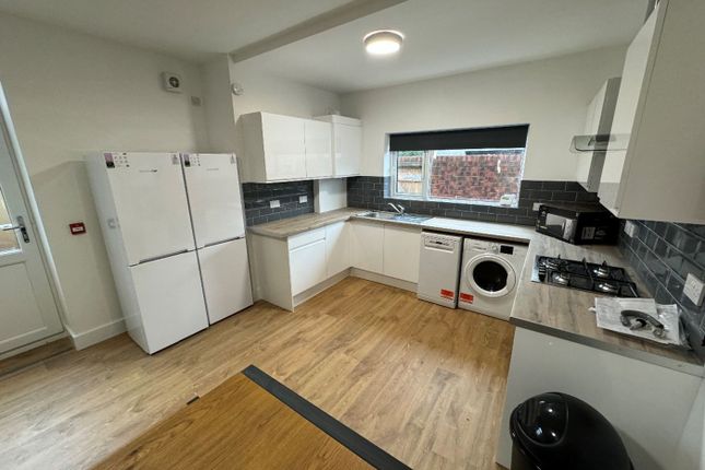 Modern Kitchen Featuring Ample Storage Space With ...
