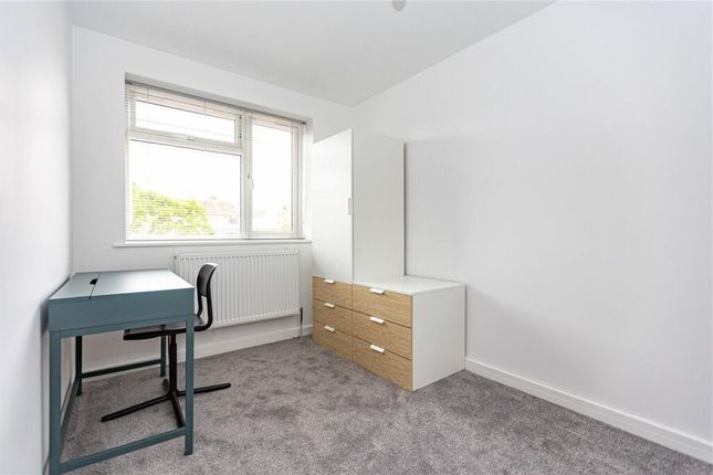 A Bright And Tidy Single Bedroom Featuring A Large...