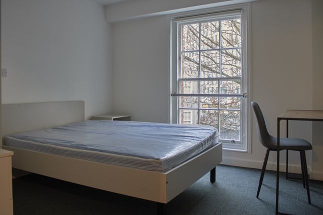 A Bright And Tidy Double Bedroom Featuring A Comfo...