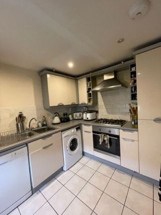 This Modern Kitchen Features A Stylish Design With...