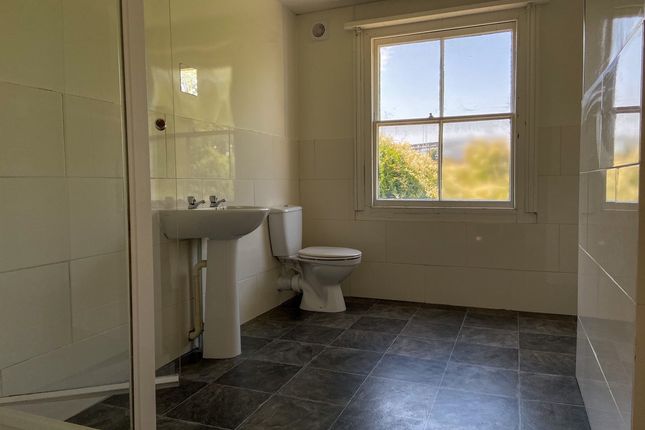 Bright And Spacious Bathroom With A Large Window, ...