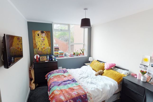 A Bright And Inviting Double Bedroom Featuring A c...