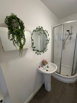 A Bright And Modern Bathroom Featuring A Stylish R...