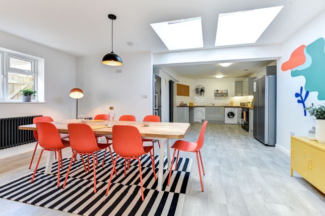 Bright And Modern Kitchen Featuring A Spacious Din...