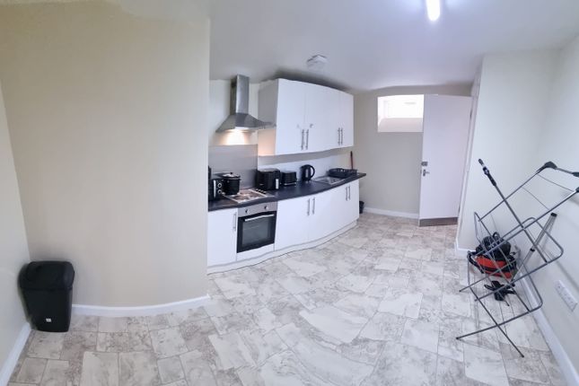 Bright And Functional Kitchen Featuring Ample Cabi...