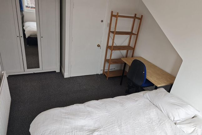 A Clean And Tidy Bedroom Space Featuring A Simple ...