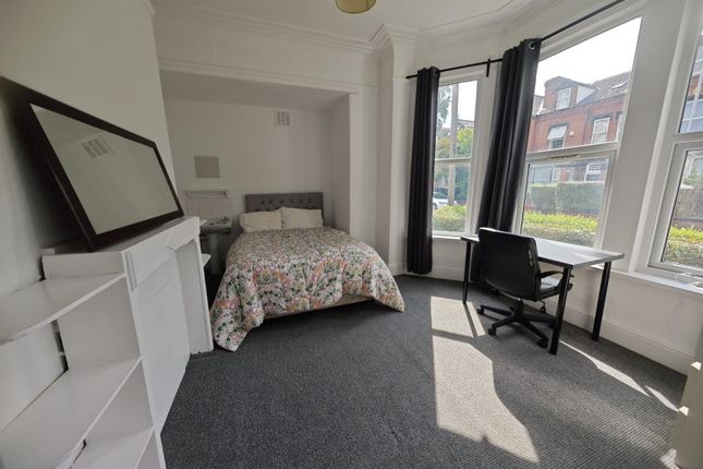 A Bright And Airy Double Bedroom Featuring A Comfo...
